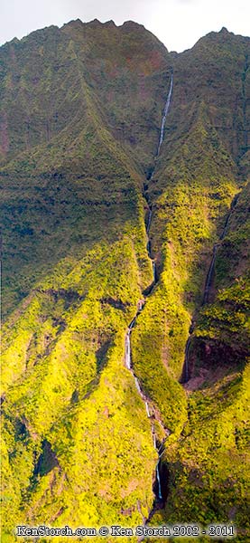 A huge vertical set of waterfalls running down the north face near Hanalei